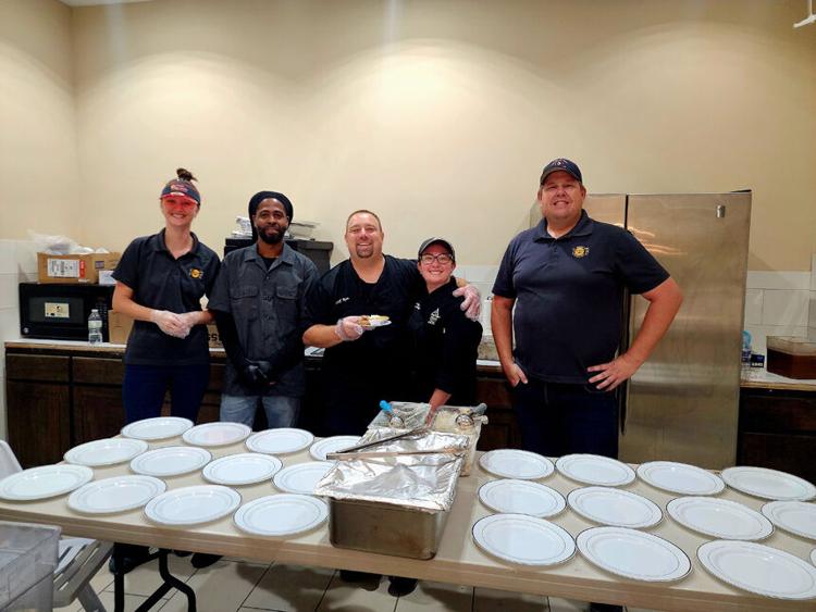 photo of chefs doing event for John 316 center, including Chef Ryan Grimm